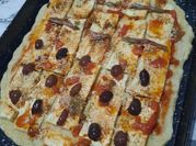 Una foto de salsa de pizza de anchoas