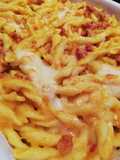 Strozzapreti alla crema di zucca, pasta di salame e provola