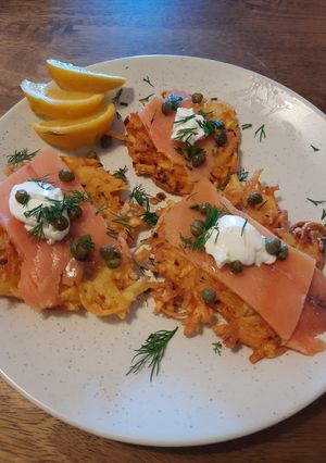 A picture of Potato pancakes with smoked salmon.