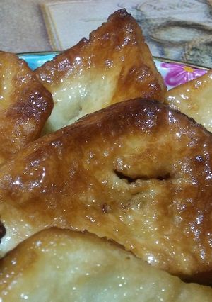 Una foto de Sopaipillas bañadas en almíbar