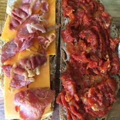 A picture of Cheese, bacon tomato sandwich for lunch.