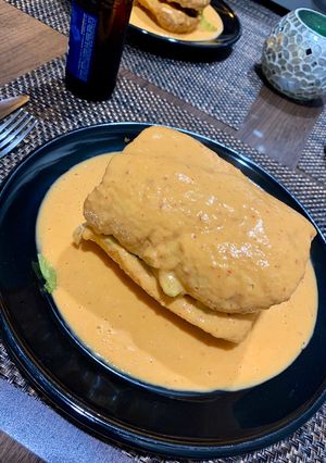 A picture of Torta Ahogada with Red Sauce.