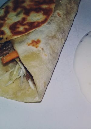 Una foto de Tacos sellados con salsa de SHAWARMA