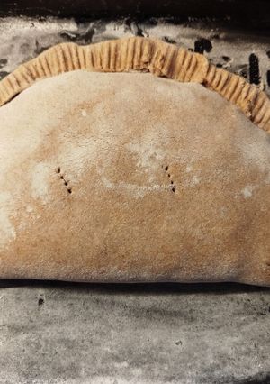 Una foto de Calzone de humita