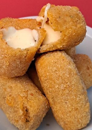 Una foto de Palitos de muzzarella a las finas hierbas