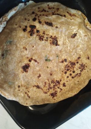 Una foto de Naan (pan indio)