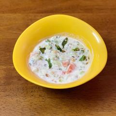 Kakdi tomato koshimbir / raita / cucumber salad A picture of Kakdi tomato koshimbir / raita / cucumber salad.