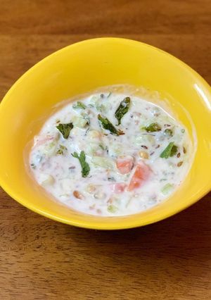 A picture of Kakdi tomato koshimbir / raita / cucumber salad.