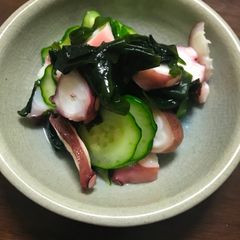 A picture of Cucumber and octopus  sunomono.