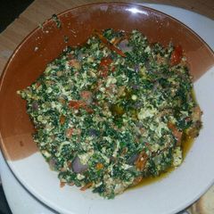 A picture of Egg sauce with veggies.