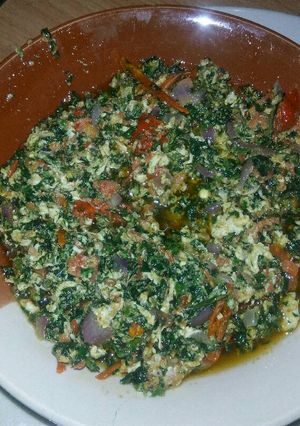 A picture of Egg sauce with veggies.