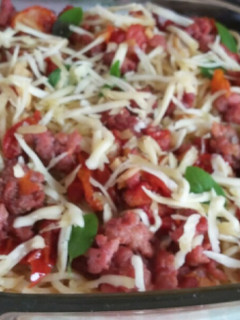 Foto de Macarrão com linguiça e tomate seco