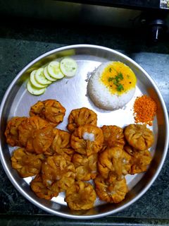 तळलेले मोदक (tadlele modak recipe in marathi) रेसिपी चे मुख्य फोटो 
