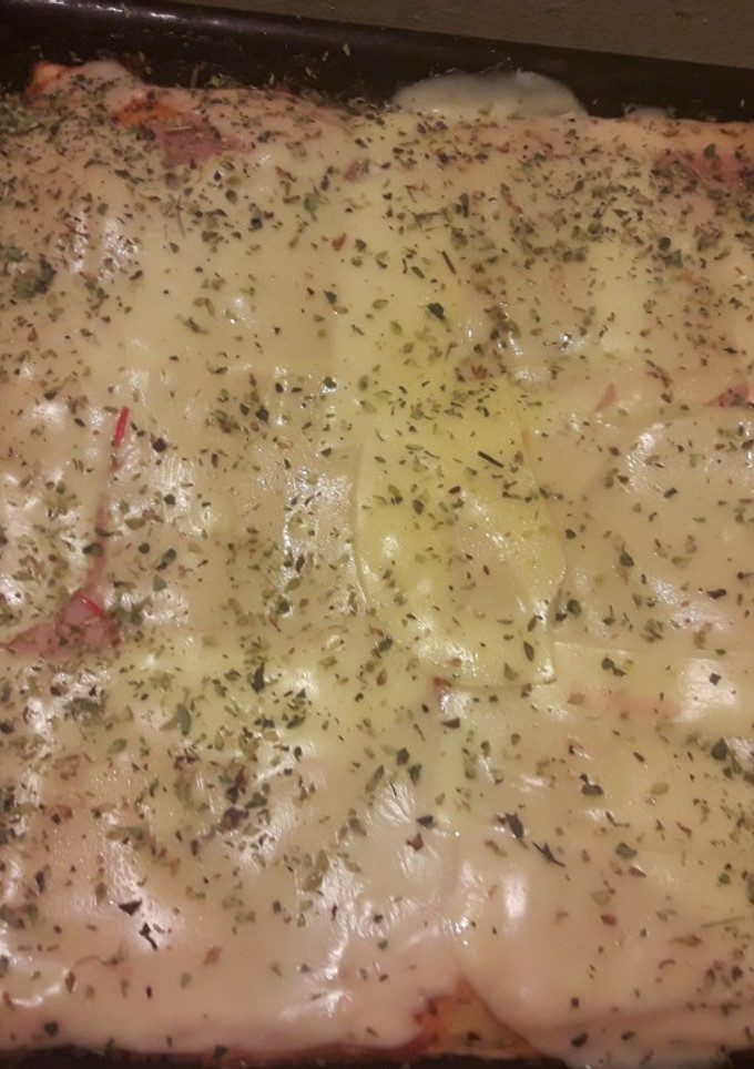 Una foto de Pizza de paleta y queso