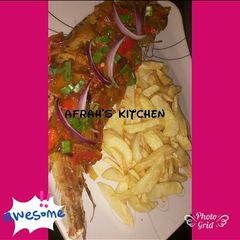 A picture of Fried potatoes with grilled fish.