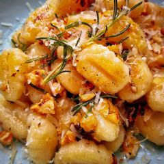 Pan Fried Gnocchi With Crispy Garlic, Toasted Walnuts & Rosemary A picture of Pan Fried Gnocchi With Crispy Garlic, Toasted Walnuts & Rosemary.