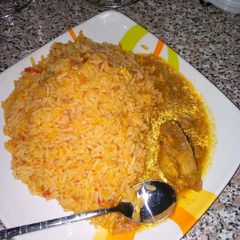 Jollof rice with chicken pepper sp A picture of Jollof rice with chicken pepper sp.
