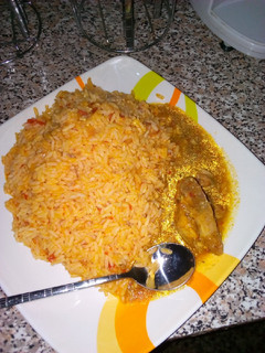 A picture of Jollof rice with chicken pepper sp.