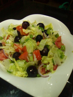 A picture of Greek salad (minus feta cheese).