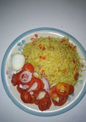 A picture of Garnished noodles and egg.