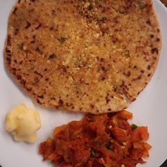 A picture of Gobhi Paratha with Tomato and Onion Bhurta.