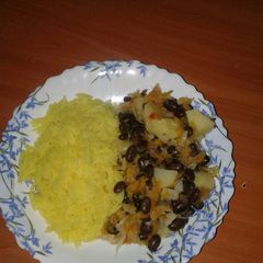 A picture of Black Njahi with Tumeric rice.