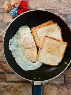 A picture of Half fried egg.