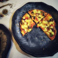 Oats whole wheat pizza with exotic veggiea A picture of Oats whole wheat pizza with exotic veggiea.