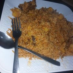 A picture of Jellof Rice with potatoes.