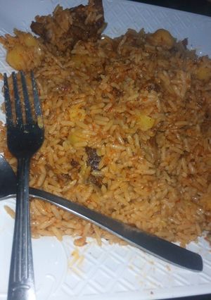 A picture of Jellof Rice with potatoes.