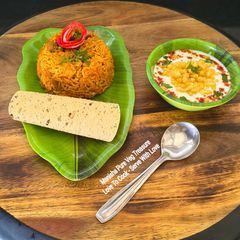 A picture of Tangy Tomato Pulao - One Pot Meal In Pressure Cooker - Tiffin - Lunchbox.