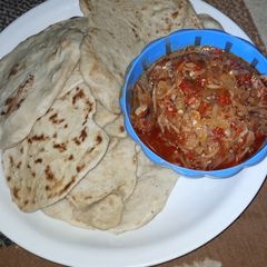 A picture of Chapati and cabbage sauce.
