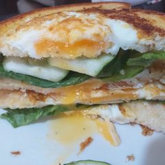 A picture of Egg in a hole sandwich.