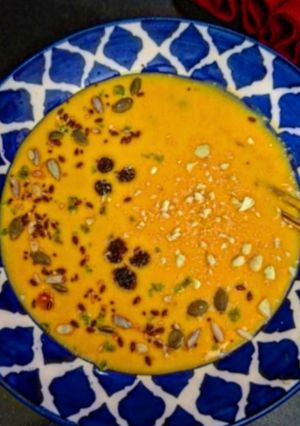 A picture of Mango Smoothie Bowl With Nuts And Mix Seeds.