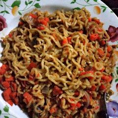 A picture of Noodles Garnished with Diced Carrot.