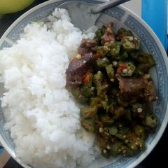 A picture of Rice served with beef Okra.