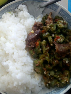 A picture of Rice served with beef Okra.