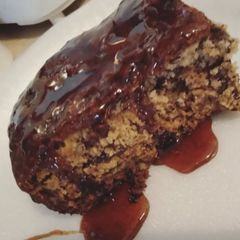 A picture of Banana-Nut Bread with Spiced Maple Syrup.