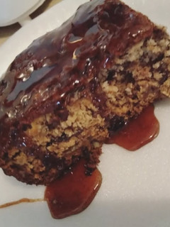 A picture of Banana-Nut Bread with Spiced Maple Syrup.