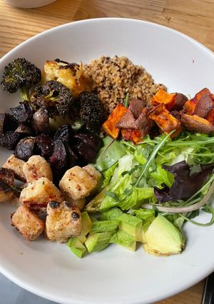 A picture of Buddha bowl with roasted veg and crispy tofu.