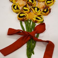 A picture of Swiss roll and candy bouquet.
