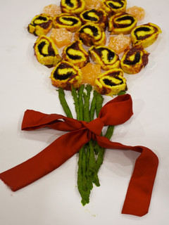 A picture of Swiss roll and candy bouquet.