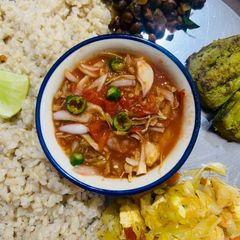 A picture of Kaddi patalghanta chudchuda (Roasted tomato with bamboo shoots).