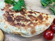 A picture of side dishes with pitas