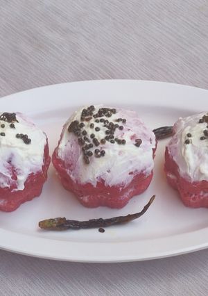 A picture of Sooji Dhokla with icing.