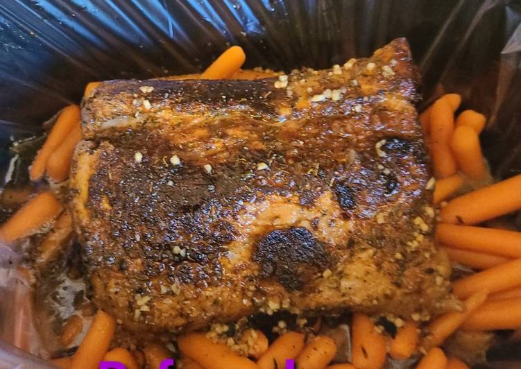 Honey garlic butter slow cooked pork roast with carrots Honey garlic butter slow cooked pork roast with carrots