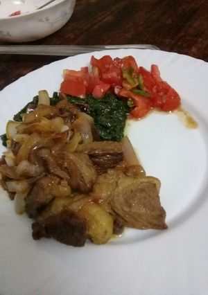 A picture of Fried beef with extra onions and kachumbari served with mto.