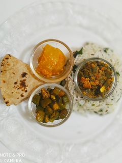 A picture of Haryali lunch with Gourd pickle.