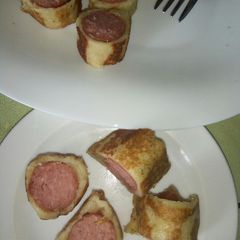 A picture of Sausage rolled in french toast bites.