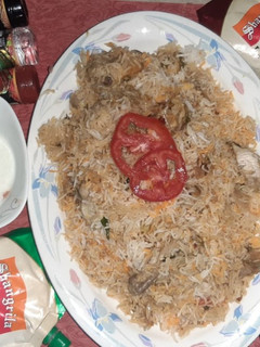 A picture of Chicken green chilli biryani.
